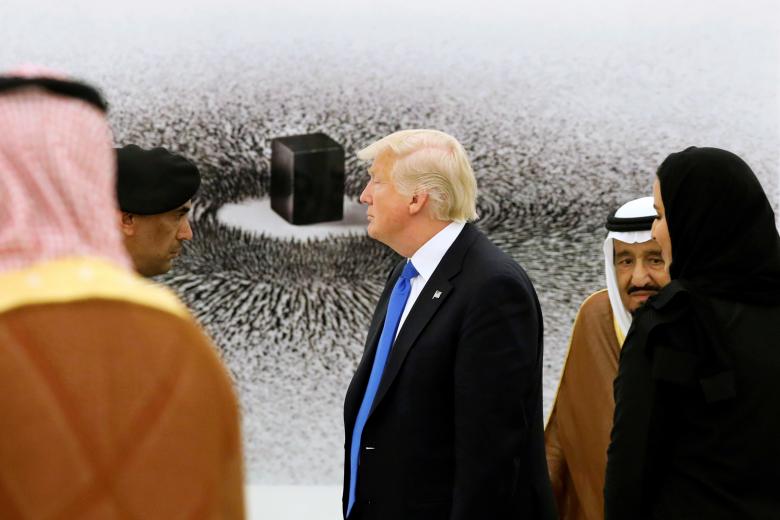 Saudi Arabia's King Salman shows Trump a depiction of the Kaaba in Mecca during a tour of pieces in the King's art collection at the Royal Court in Riyadh