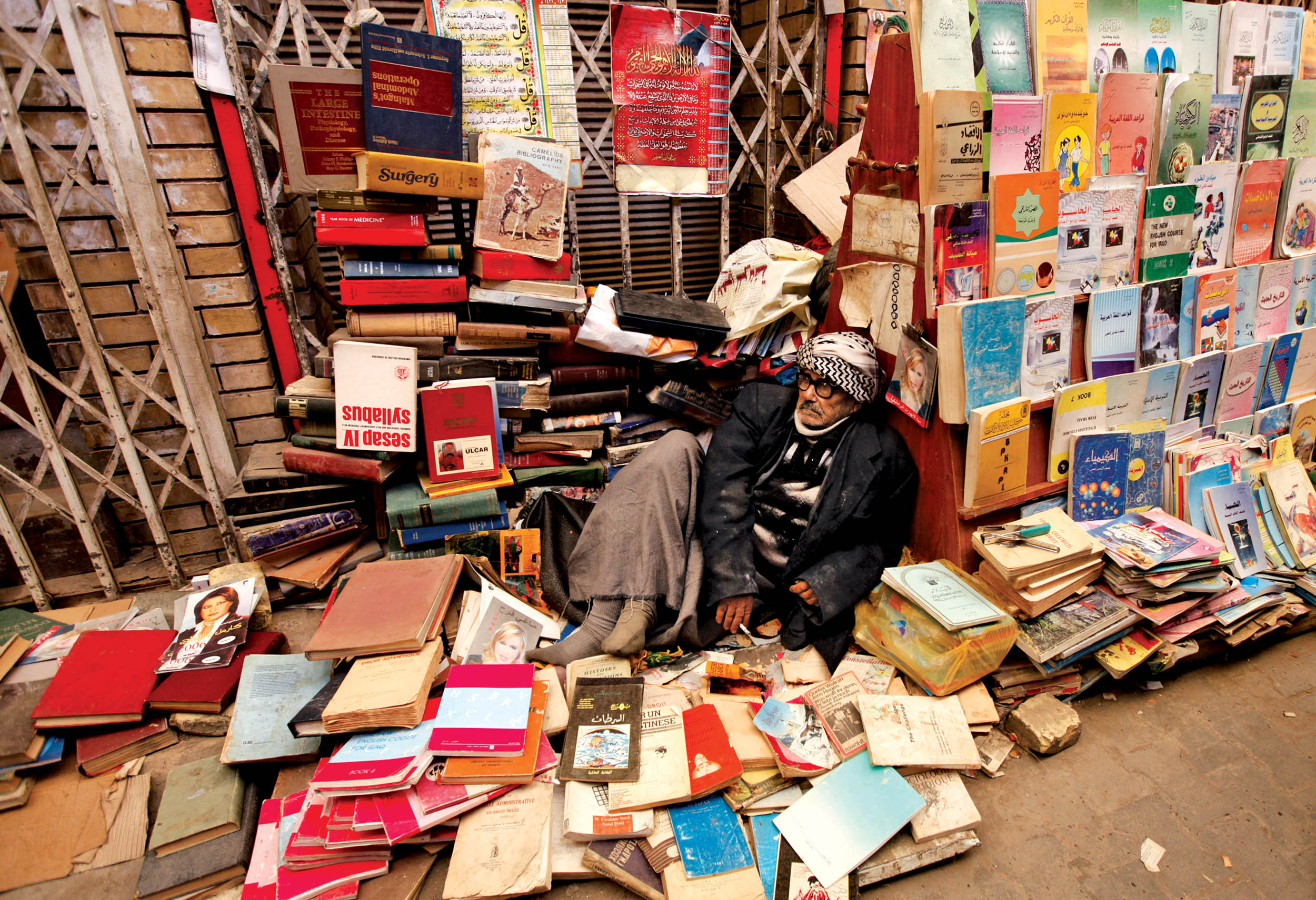 An elderly man sells books at Mutanabi Street in Baghdad