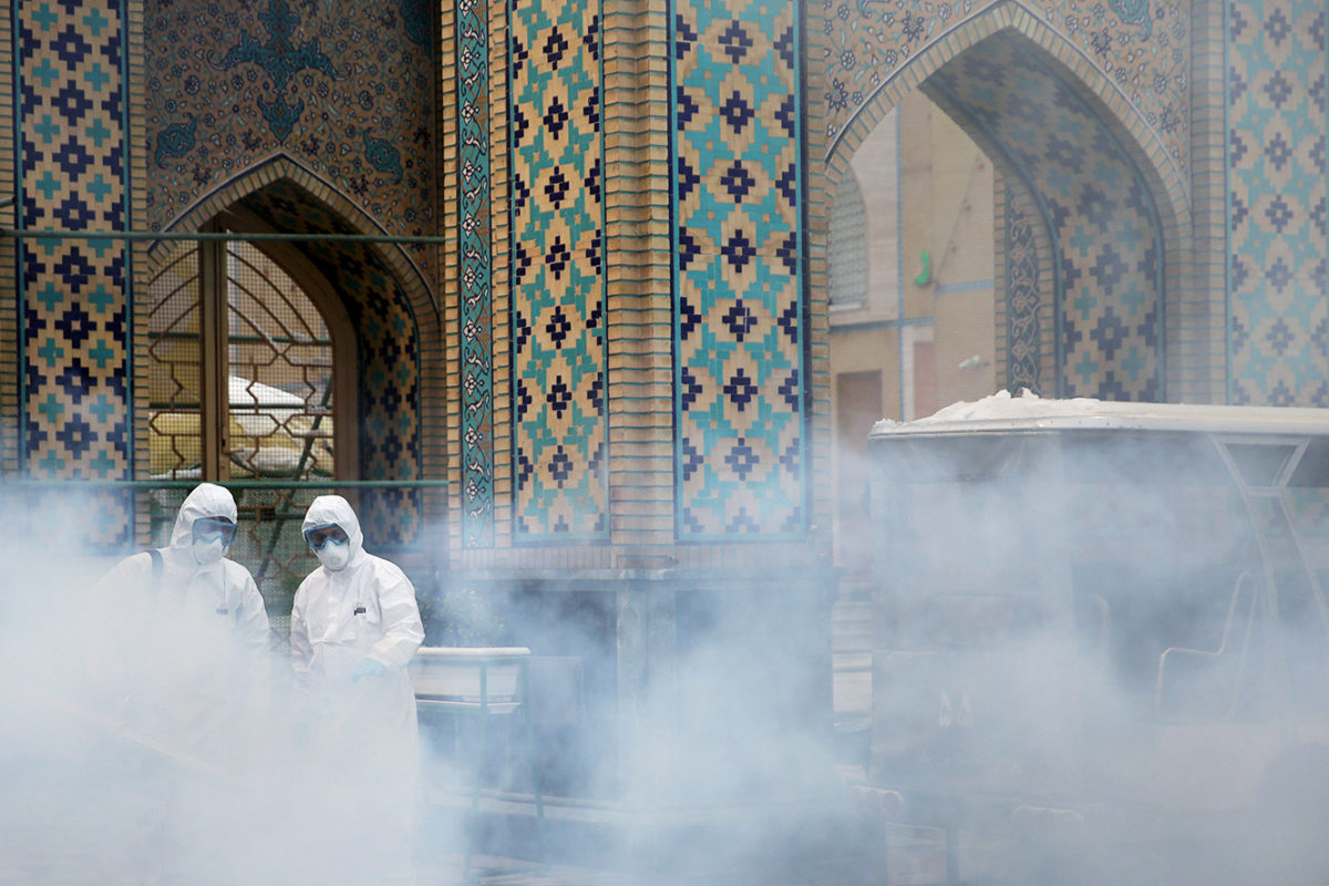 COVID-19 in Iran - medical team spray mosque